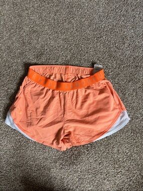 Under Armour Coral Orange Women’s Athletic Shorts with White Panels